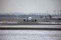 Planes at terminal gates in Munich Airport, winter time with snow